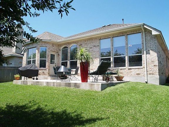 Outside features include sprinkler system & enlarged patio