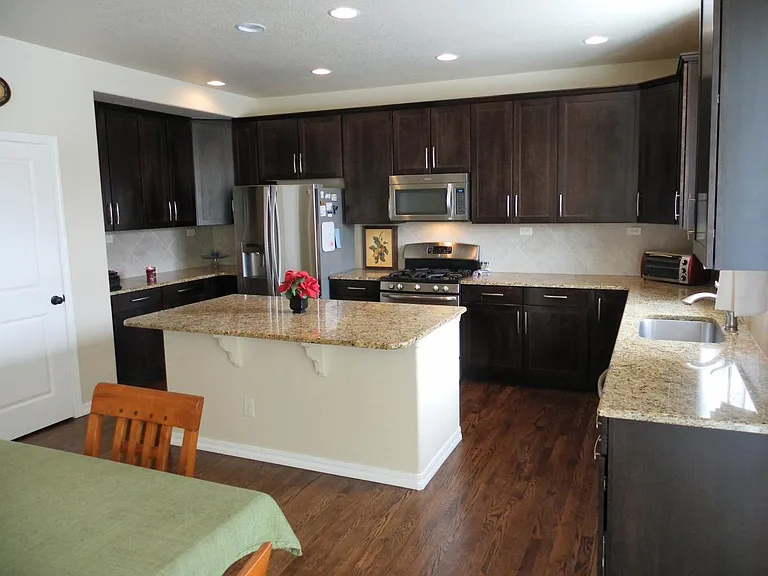 Gourmet kitchen with upgraded appliances and gas range