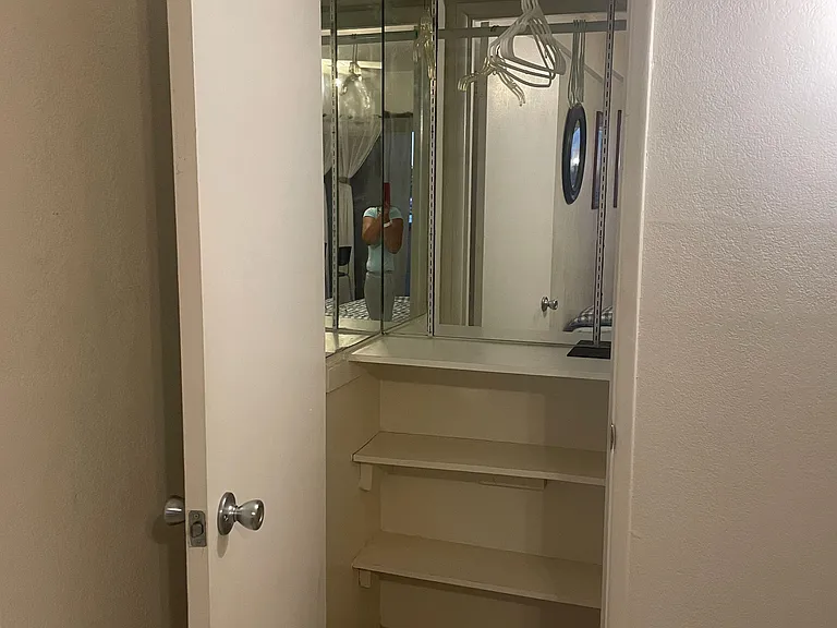 A mirror small closet.