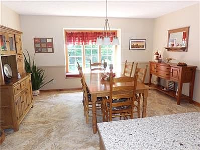Large formal dining room with bay window & open to the kitchen.