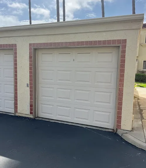 One car detached garage across from entry door of unit