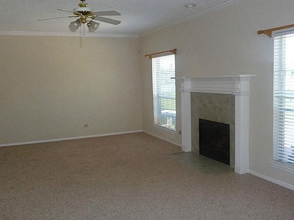 Large family room with new carpet and view of the water.