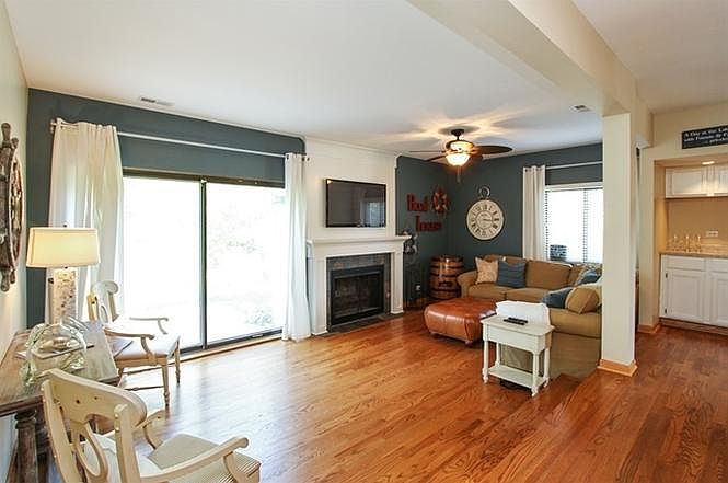 Living Room with Fireplace, and Butler's Pantry. Wood floors throughout first floor. Lots of light!