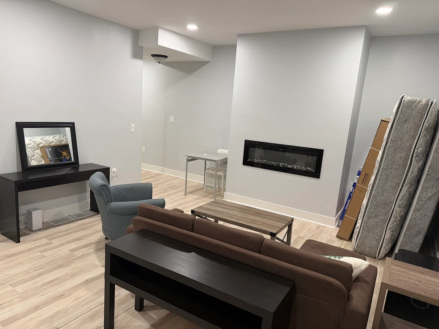 65 inch TV will be mounted on the wall. Extra furniture will be moved downstairs when the basement/ground floor bedroom is complete.