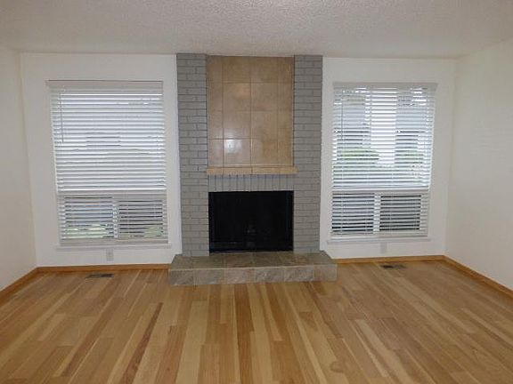 Spacious living room with real hardwood floors.