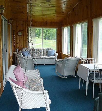 Enjoy the Seasons : Spacious insulated sun porch allows you to take in the views year round.