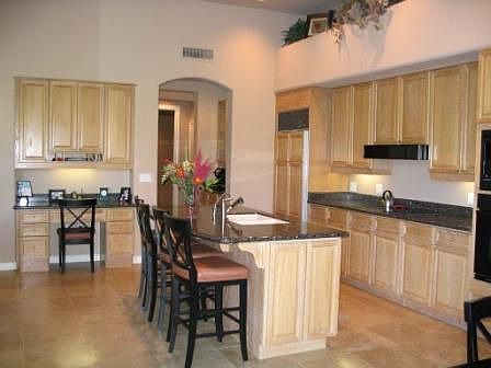 Kitchen w granite, travertine, high end appliances, 42 inch hardwood cabinets