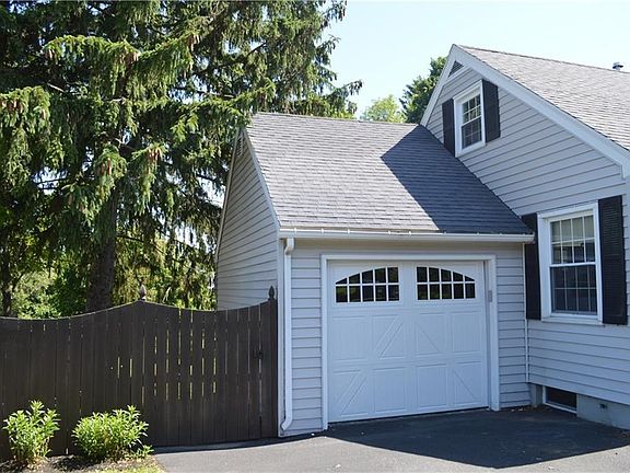 Attached one-car garage.  Gate on fence leads to spacious back yard