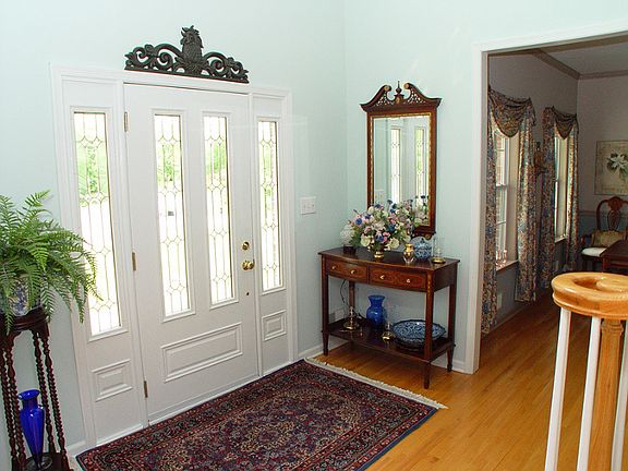 Two-story entry foyer with hardwood floors