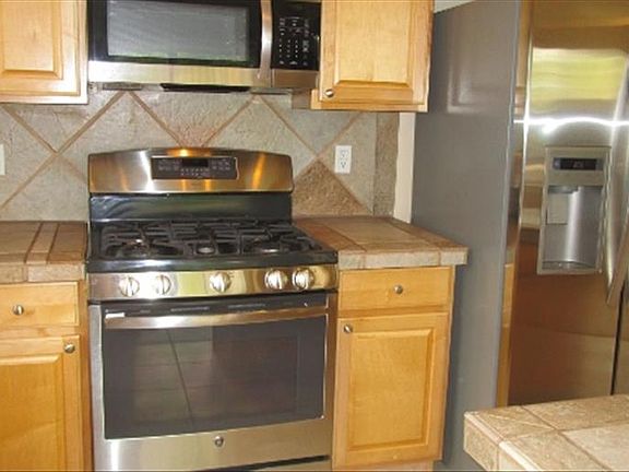 Stainless steel appliances and center island