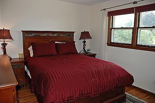 The 3 generous BRs on main level have gleaming HW floors!