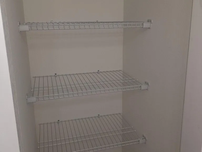 1 of 2 extra storage closets in hallway bathroom