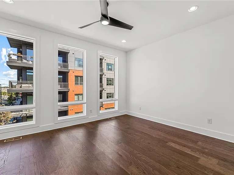 Main Bedroom (Note: Actual unit has light wooden floors and upgraded fixtures / appliances)