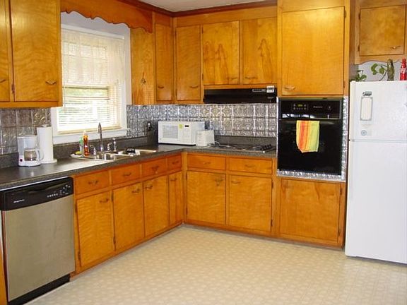 Large kitchen (new countertop, sink, oven, cooktop, backsplash, outlets)
