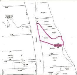 A view of the irregular lot the shaded area is the shared driveway to the beachfront. The north bord