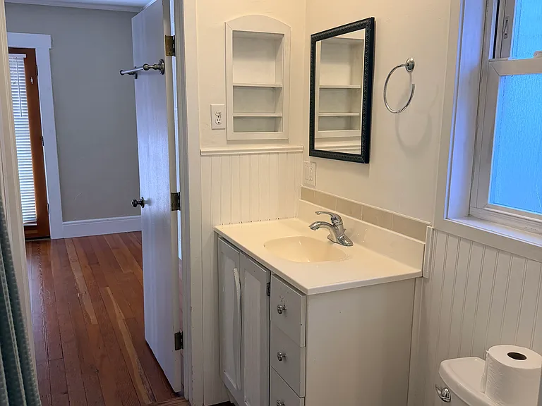bathroom. shower, shelving for linens, bidet toilet