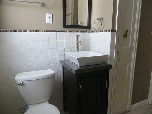 Modern sink with granite countertop.