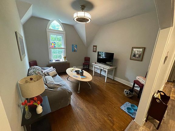 Livingroom with Vaulted Ceiling, Hardwood Flooring, LED Lighting & Ceiling Fan.