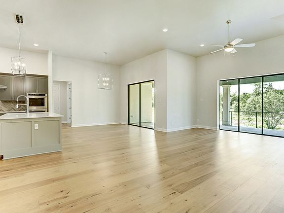 The Mantle plan has an incredible, open layout with gorgeous wood flooring.