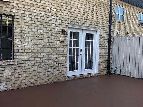 Back patio with access to carport and storage.
