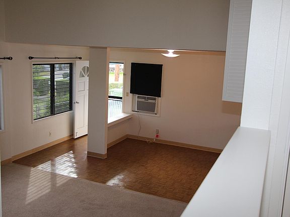View from upstairs, looking toward entry and dining area. Li