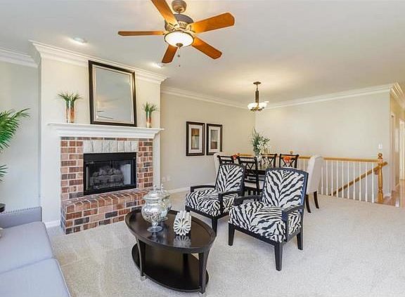 Great Room with Brick Surround Wood Burning Fireplace