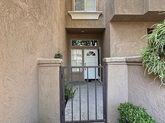 Gate and Small front yard and front door.