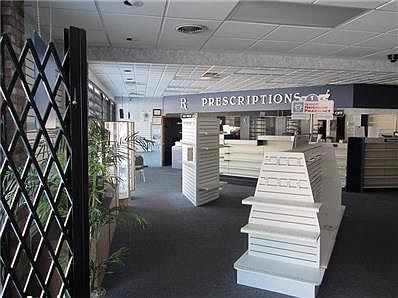Pharmacy- From the front door you can see to your right is the public bathroom. Next doorway to the left of bathroom is the Large storage room.