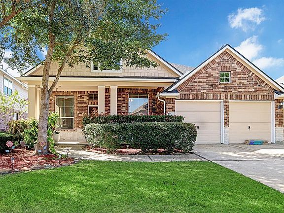 Drive-up to a gorgeous and equally charming elevation with covered front porch