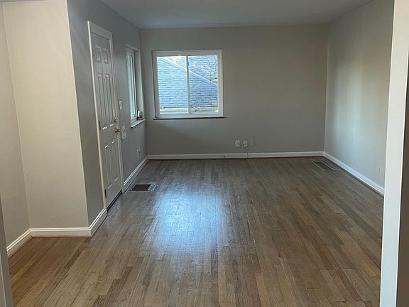 Living room area. All hardwood floors.