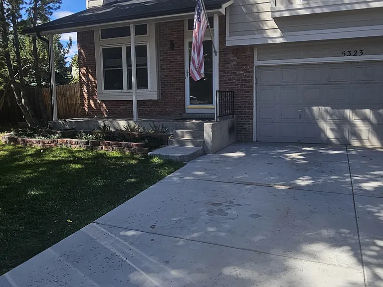 Front, new driveway, 2 car garage