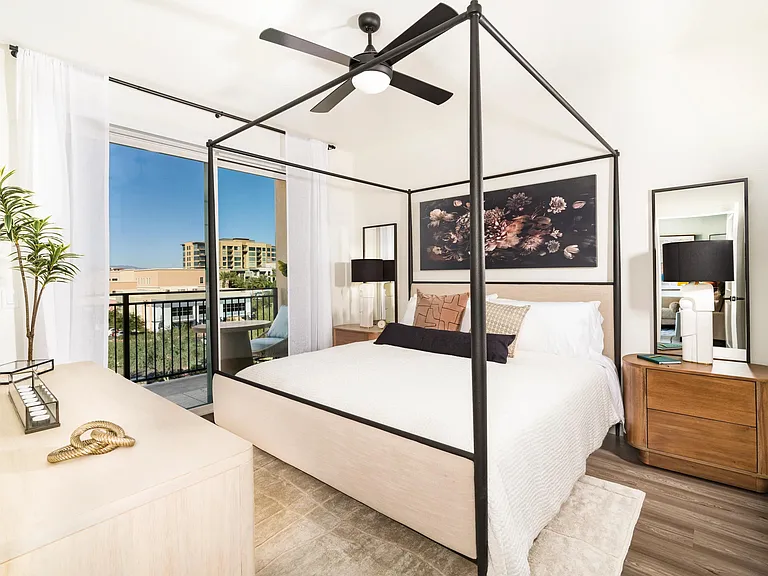 Spacious bedroom layout with large windows and balcony access, offering plenty of natural light and room to personalize your retreat.