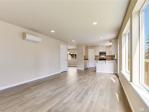 Open concept floor plan provides a seamless transition from the living room to nook to kitchen.