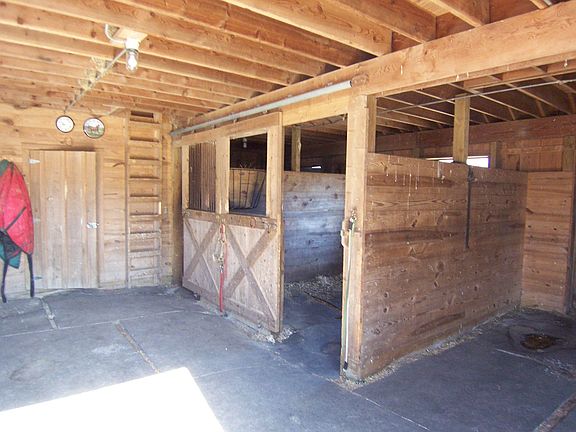 2 stall barn w/ hay loft,electric, water and tack room