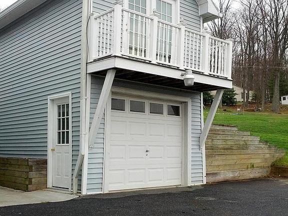 Garage with balcony and finished room above