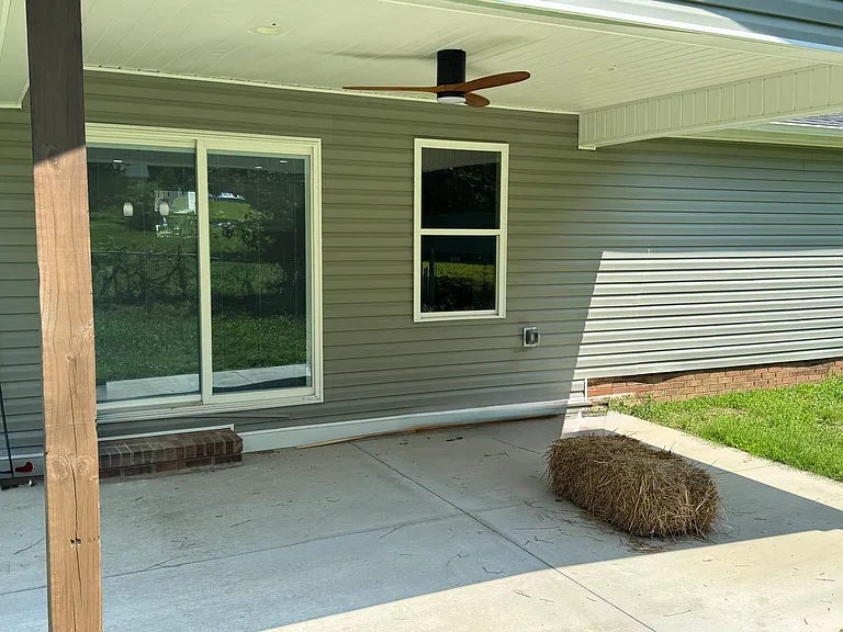 Covered concrete backyard patio