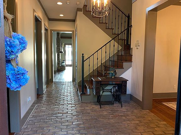 Open foyer with brick floors