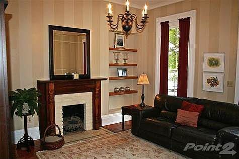 tone-on-tone paint job and gas fireplace along with front windows to the floor make this room an elegant venue for entertaining OR a quiet retreat for reading a good book.