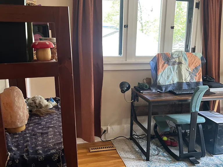 April 2026- Entering into the second, back bedroom. Same layout as the first. Facing the first of two large windows. Fully functional with new screens.