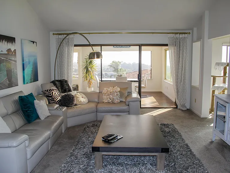 Living room with vaulted ceilings.
