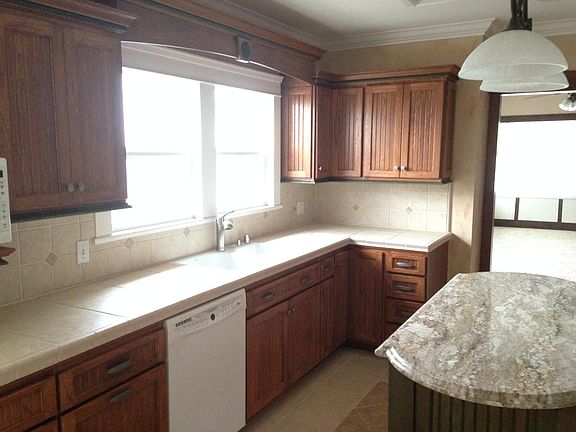 Newly remodeled kitchen with granite top island