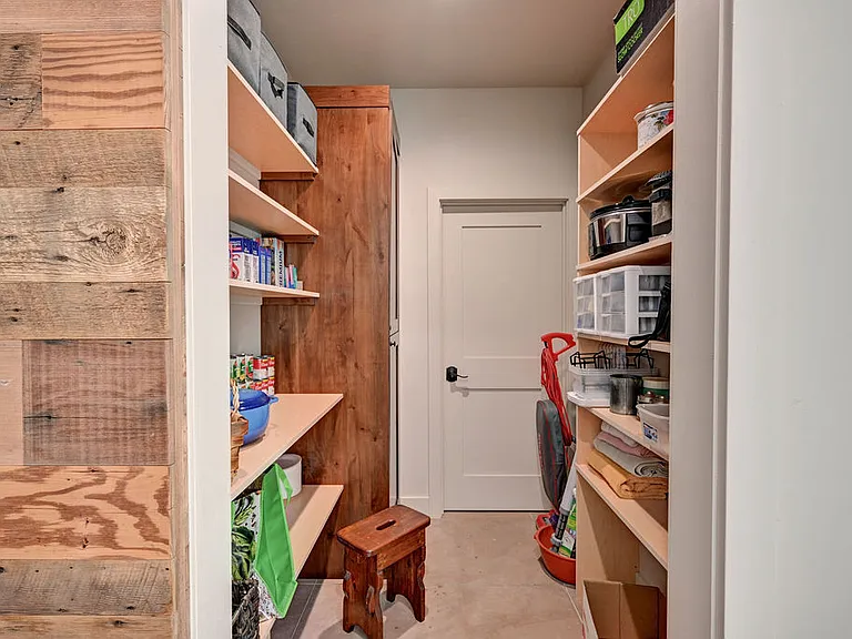 The walk-in pantry is perfect to tuck all of your provisions away. Be sure to tuck a few shopping bags in your vehicle to use on your grocery trips.