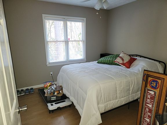 Bedroom with hardwood floors.