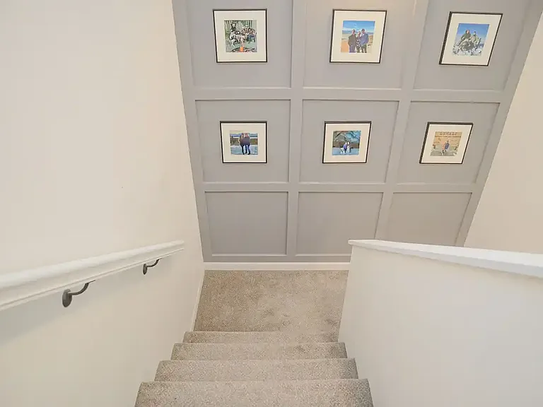 Staircase with board and batten wall