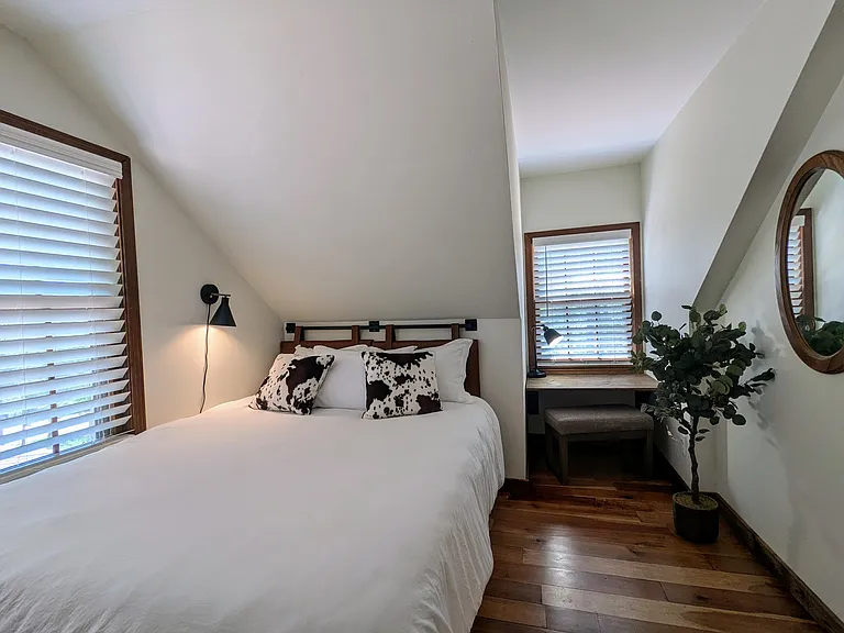 UPSTAIRS BEDROOM 3 (sleeps 2): Queen Bed and Small Desk Area. Comfortably get ready for the day with private in-room mirror!