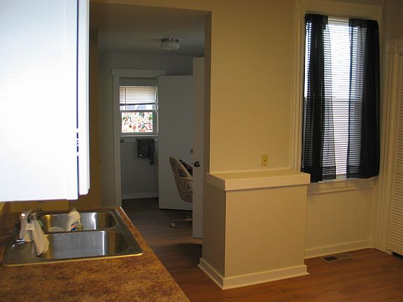 KITCHEN LOOKING TO BACK DOOR/POWDER