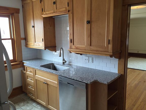 Remodeled kitchen with contemporary cabinets and granite counter-tops. Stainless steel dishwasher. Includes new refrigerator.