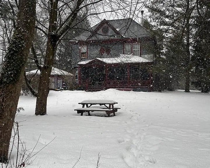 The east yard in winter - picnic table and plenty of space for snowmen.