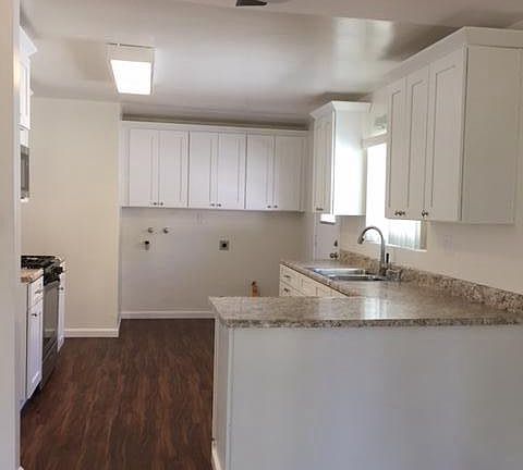 All Interior is renovated. Washer and dryer hook-up on side of kitchen. Ceiling fans in all bedrooms and dining area.