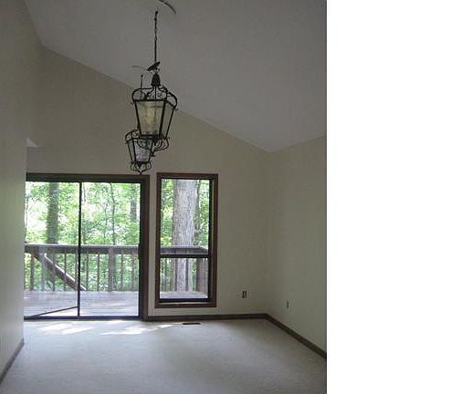 open dining/living room with vaulted ceilings